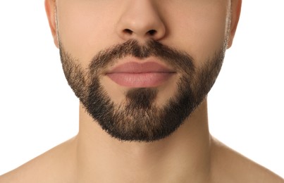 Young man with beard after shaving on white background, closeup