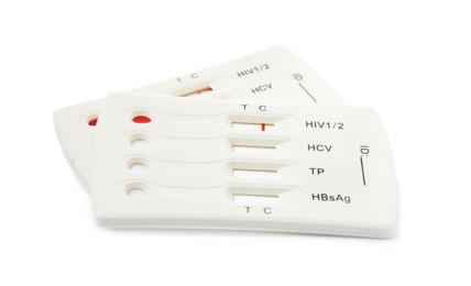 Photo of Two disposable express tests for hepatitis on white background