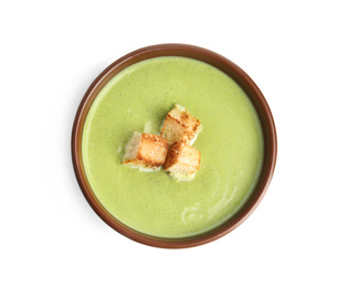 Photo of Delicious broccoli cream soup with croutons isolated on white, top view