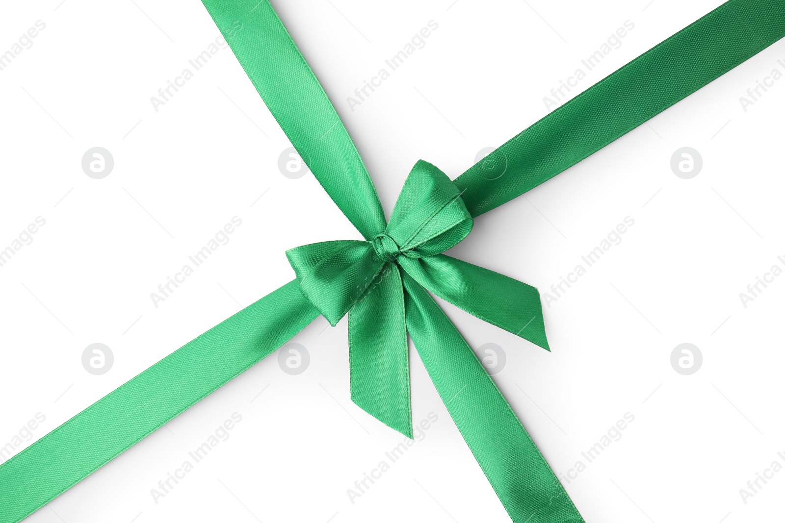 Photo of Green satin ribbon with bow isolated on white, top view