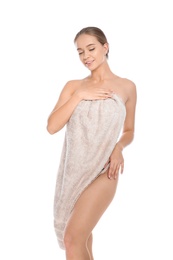 Portrait of young pretty woman with towel on white background