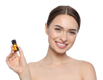 Photo of Young woman with bottle of essential oil on white background
