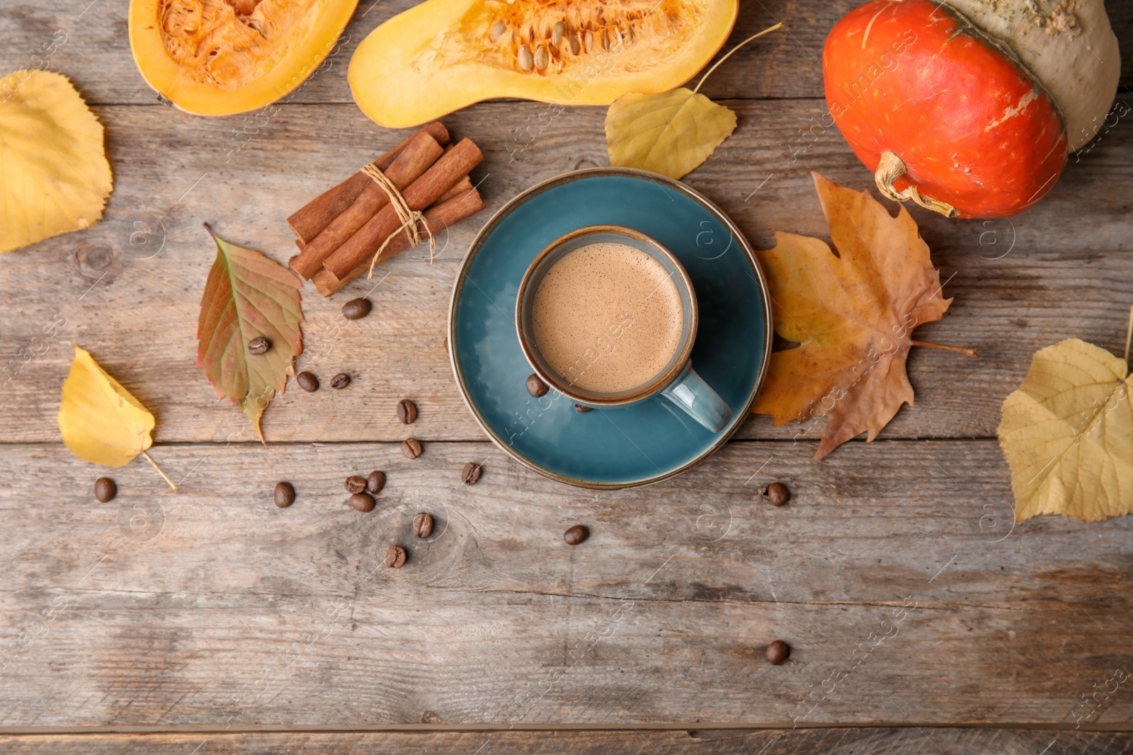 Photo of Flat lay composition with pumpkin spice latte and space for text on wooden background