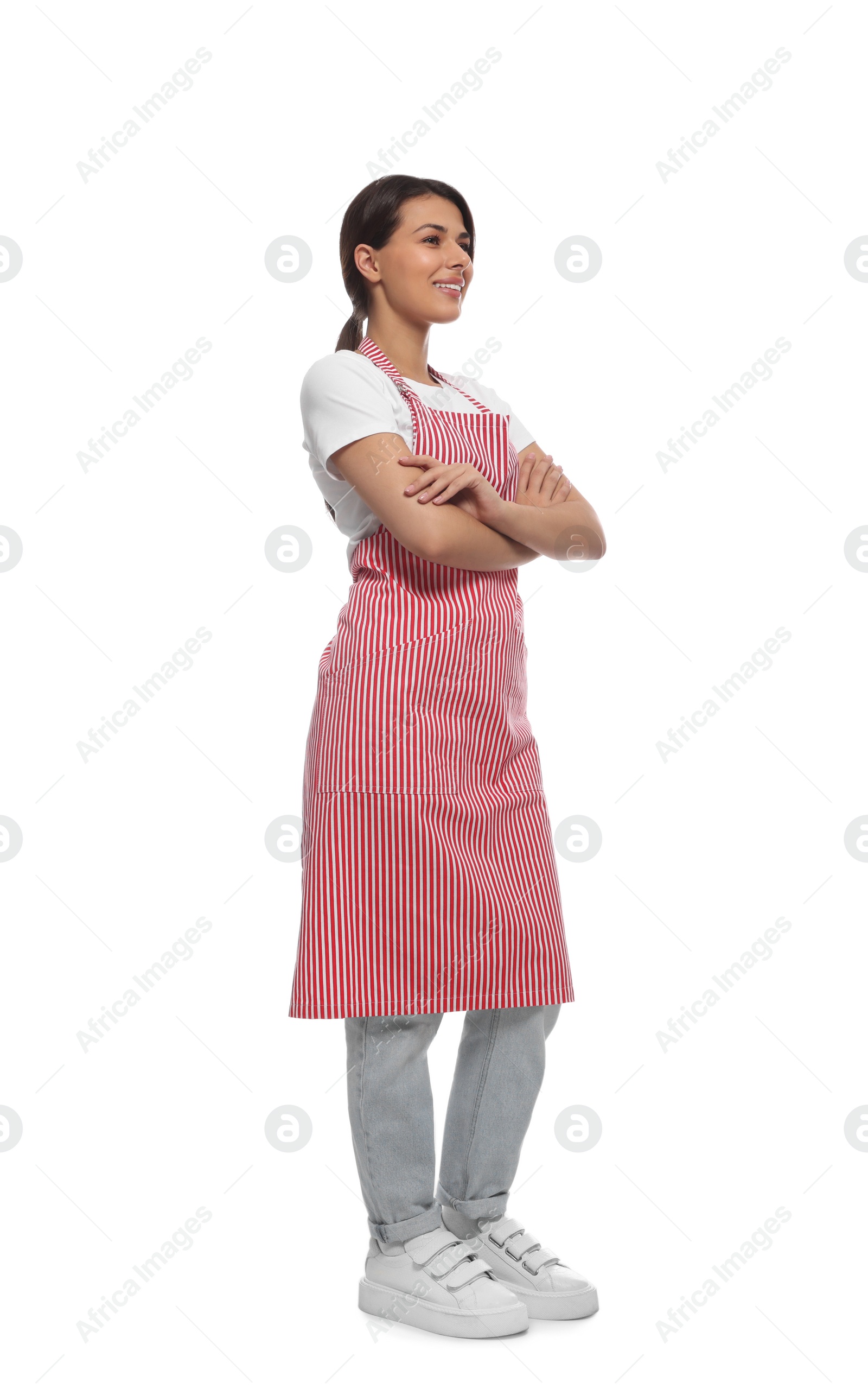 Photo of Young woman in red striped apron on white background