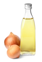 Photo of Glass bottle of onion syrup and fresh ingredient on white background