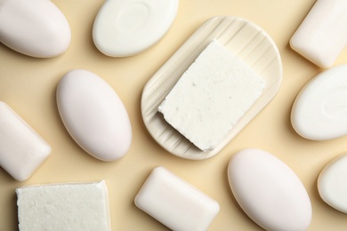 Soap bars on color background, top view