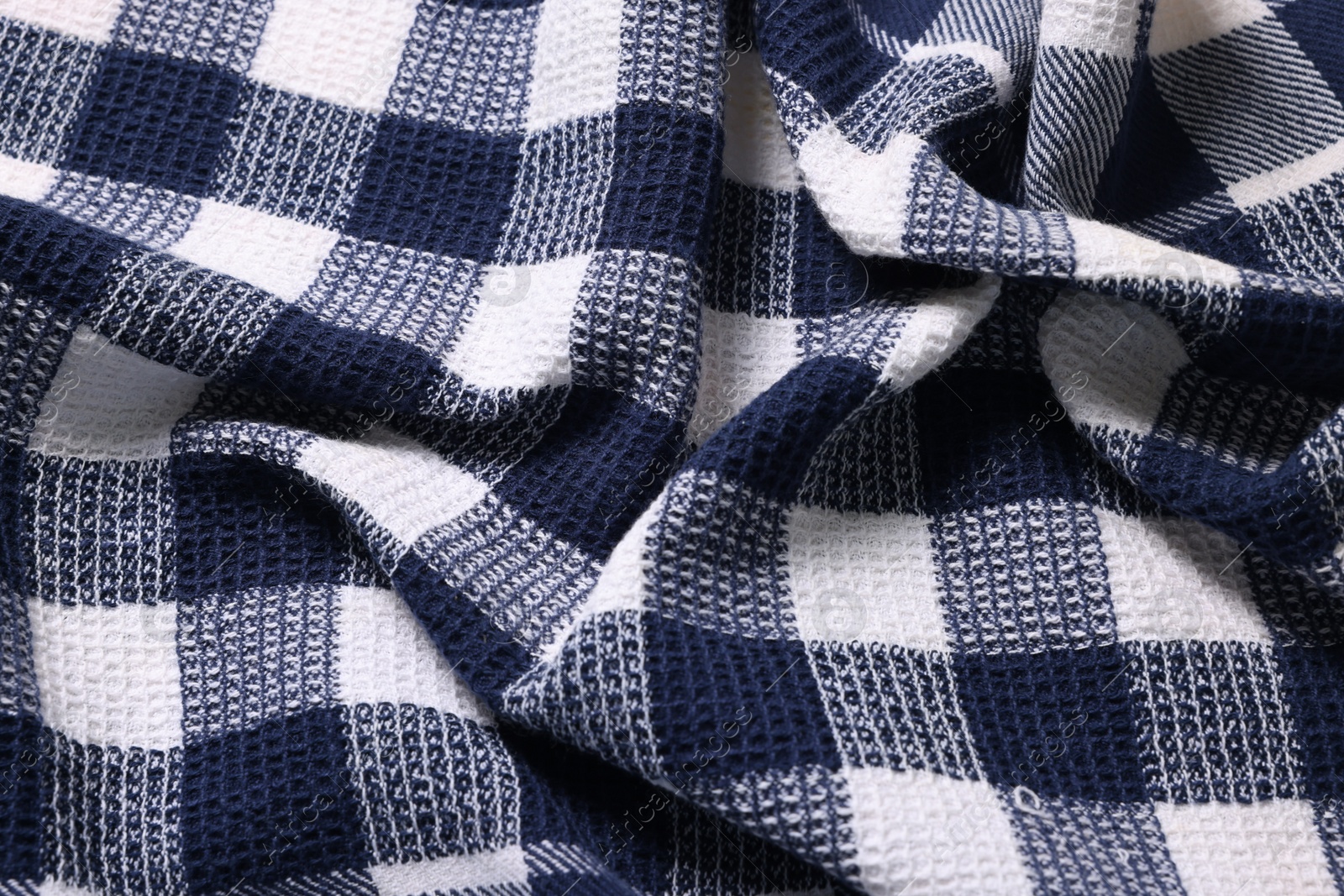 Photo of Texture of crumpled checkered fabric as background, top view