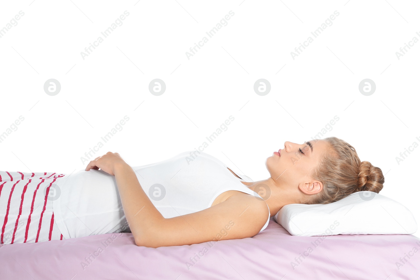 Photo of Beautiful woman sleeping with orthopedic pillow on bed against white background