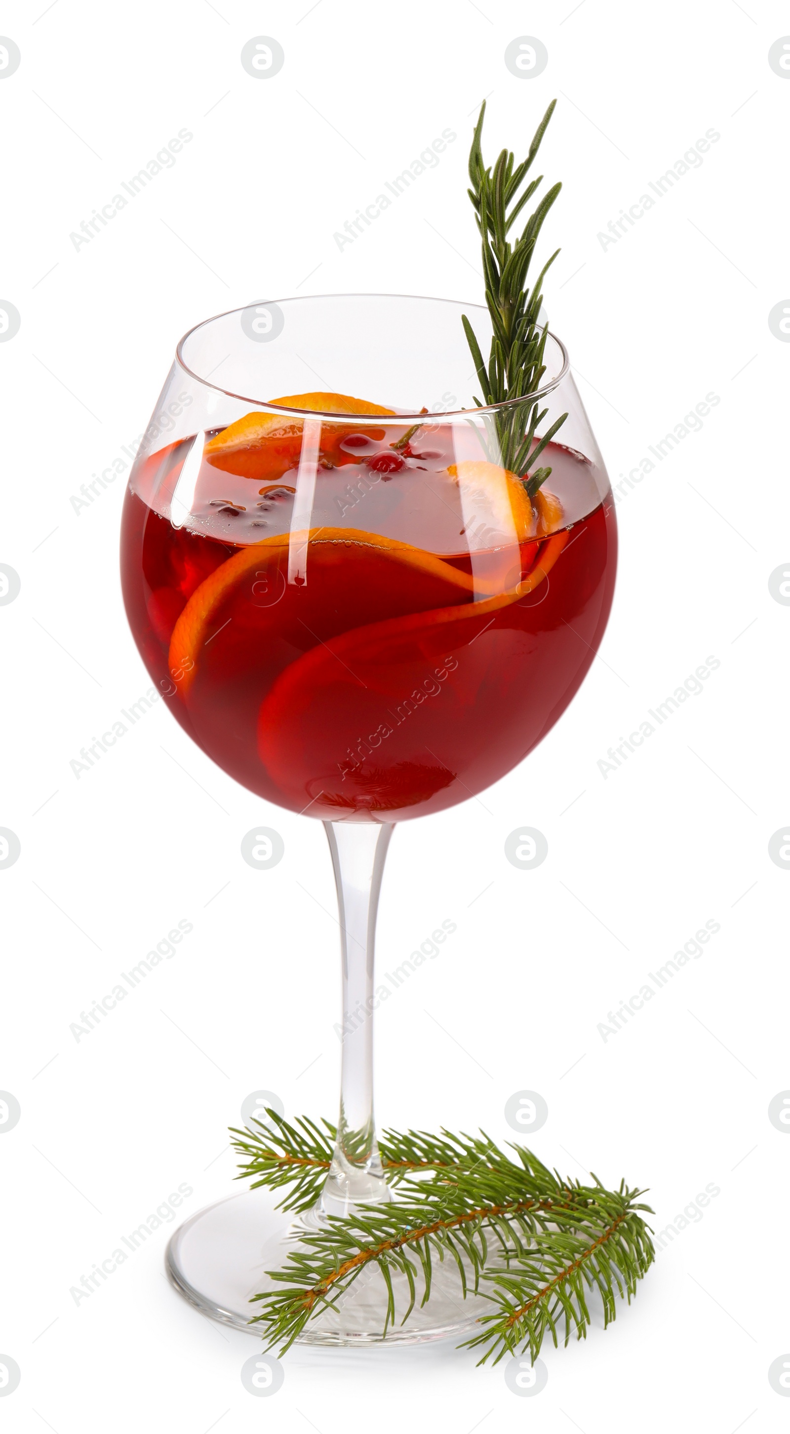 Photo of Christmas Sangria cocktail in glass and fir tree branch isolated on white