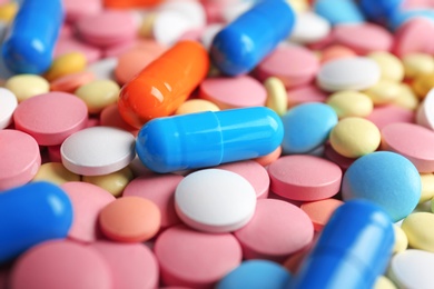 Photo of Many colorful pills as background