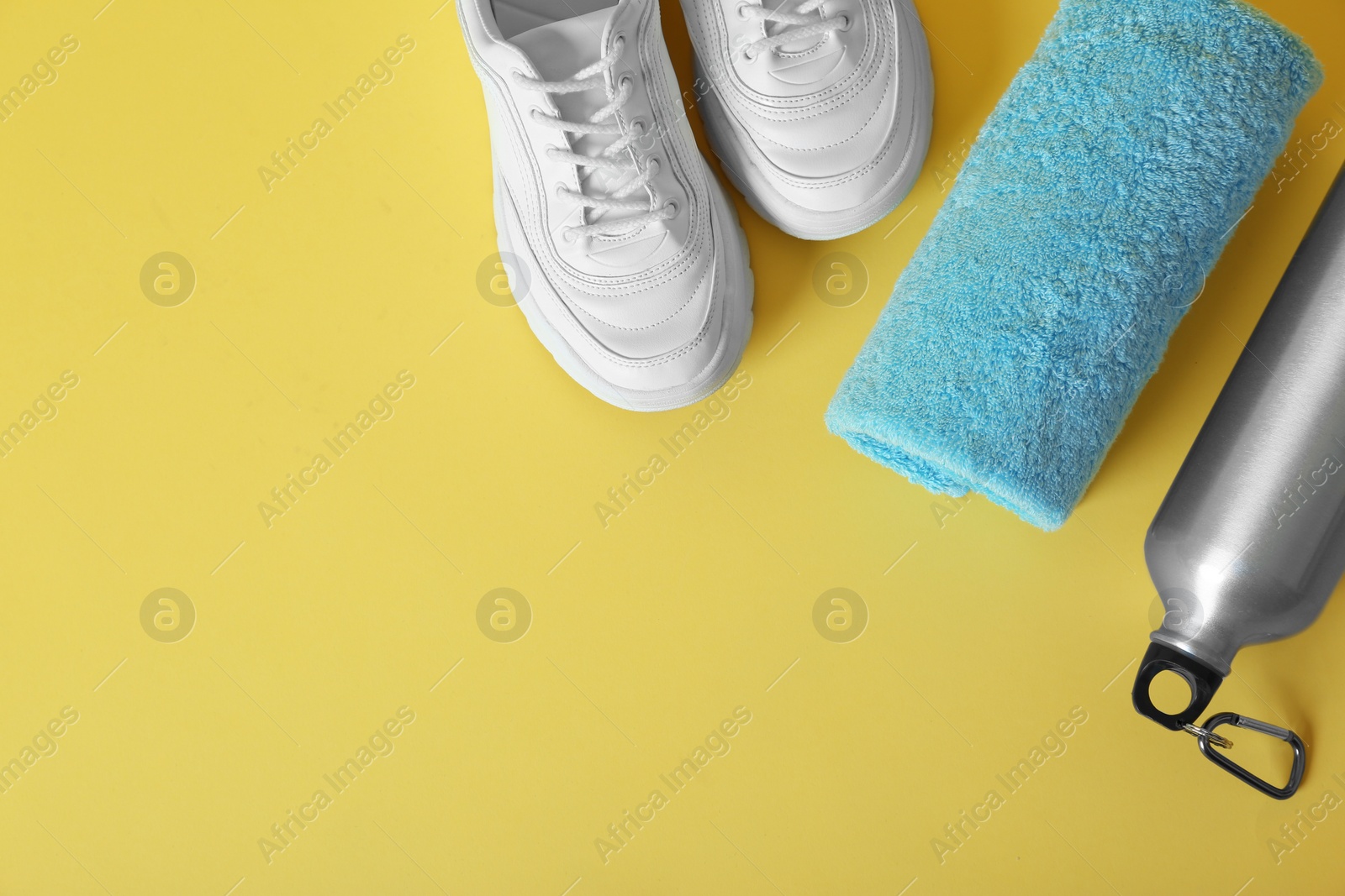 Photo of Flat lay composition with fitness equipment and space for text on color background