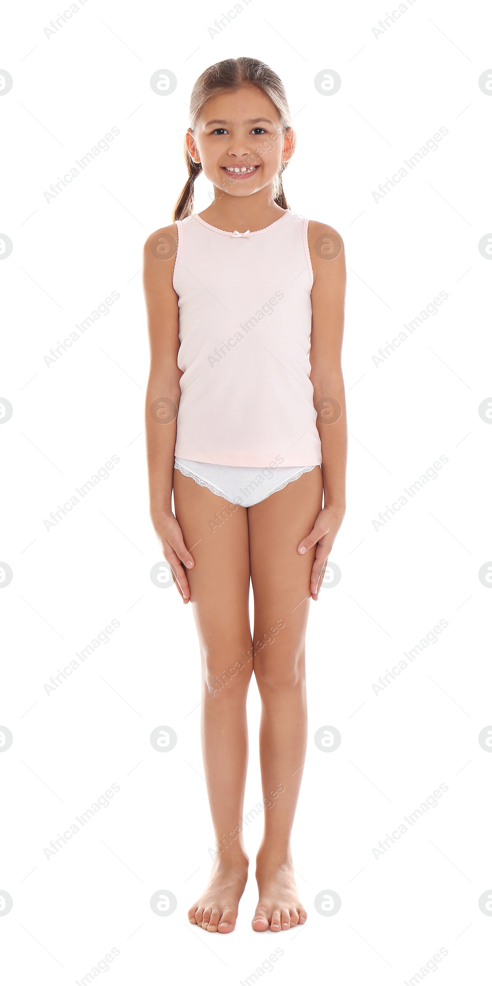 Photo of Cute little girl in underwear on white background