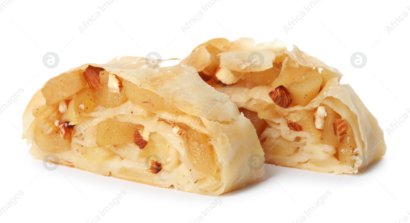 Photo of Pieces of delicious apple strudel with almonds on white background