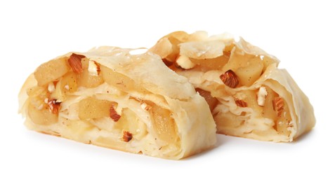 Photo of Pieces of delicious apple strudel with almonds on white background