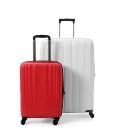 Photo of Modern suitcases for travelling on white background