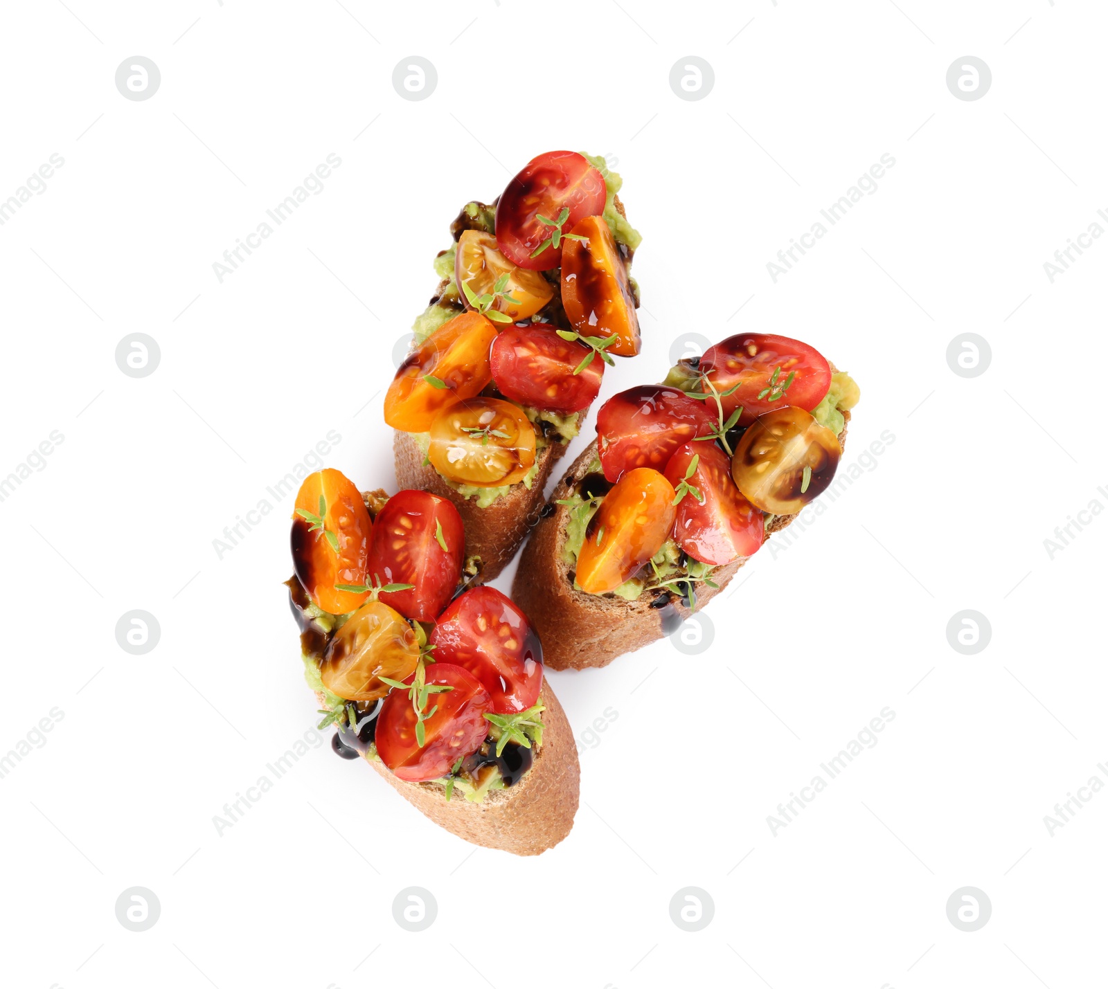 Photo of Delicious bruschettas with avocado, tomatoes and balsamic vinegar isolated on white, top view