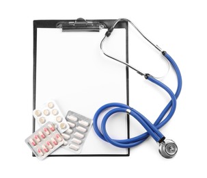 Photo of Stethoscope, pills and clipboard isolated on white, top view. Medical tool