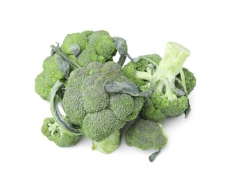 Photo of Pile of fresh raw green broccoli isolated on white