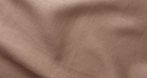 Texture of brown crumpled fabric as background, top view