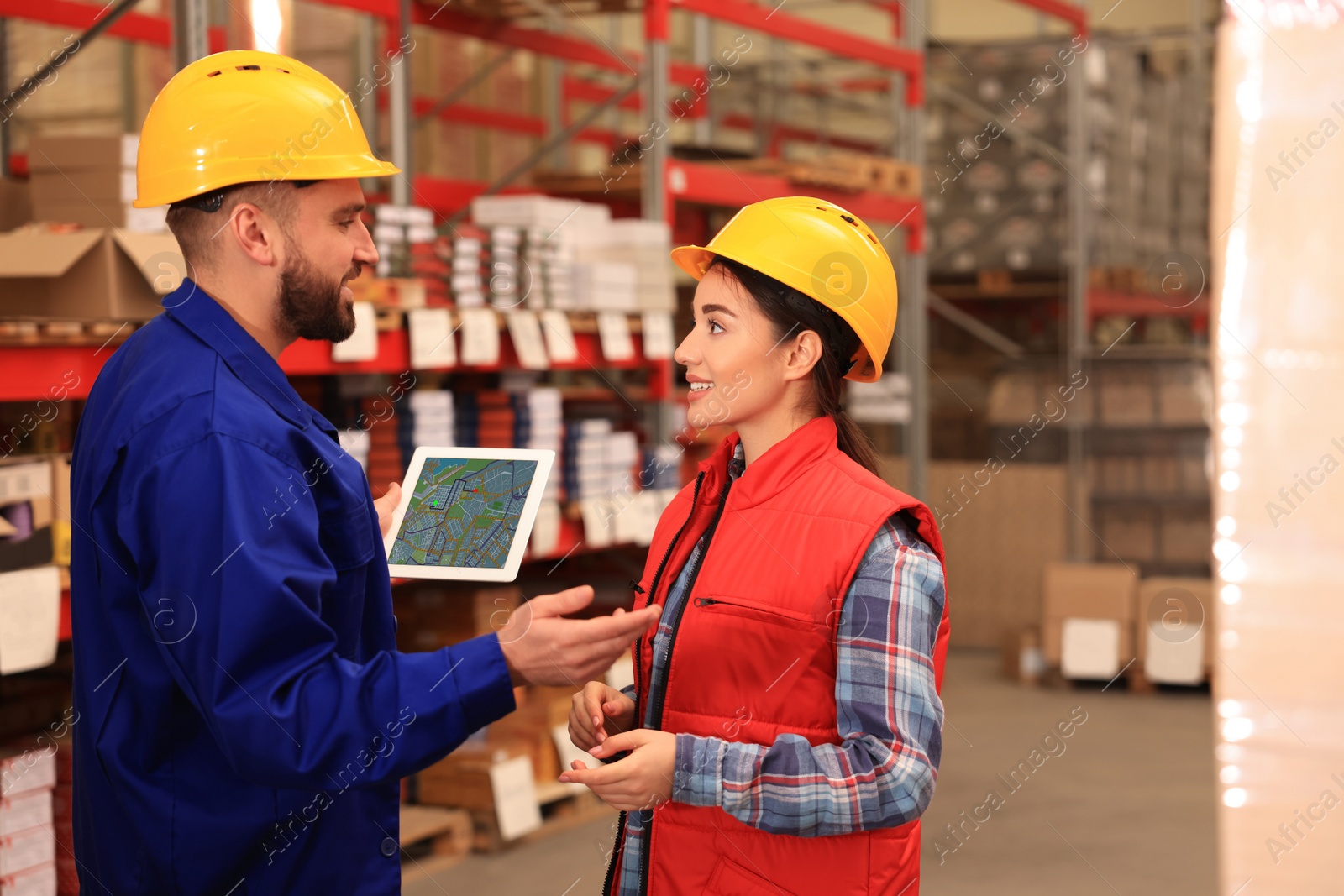 Image of Manager and worker at warehouse. Logistics center