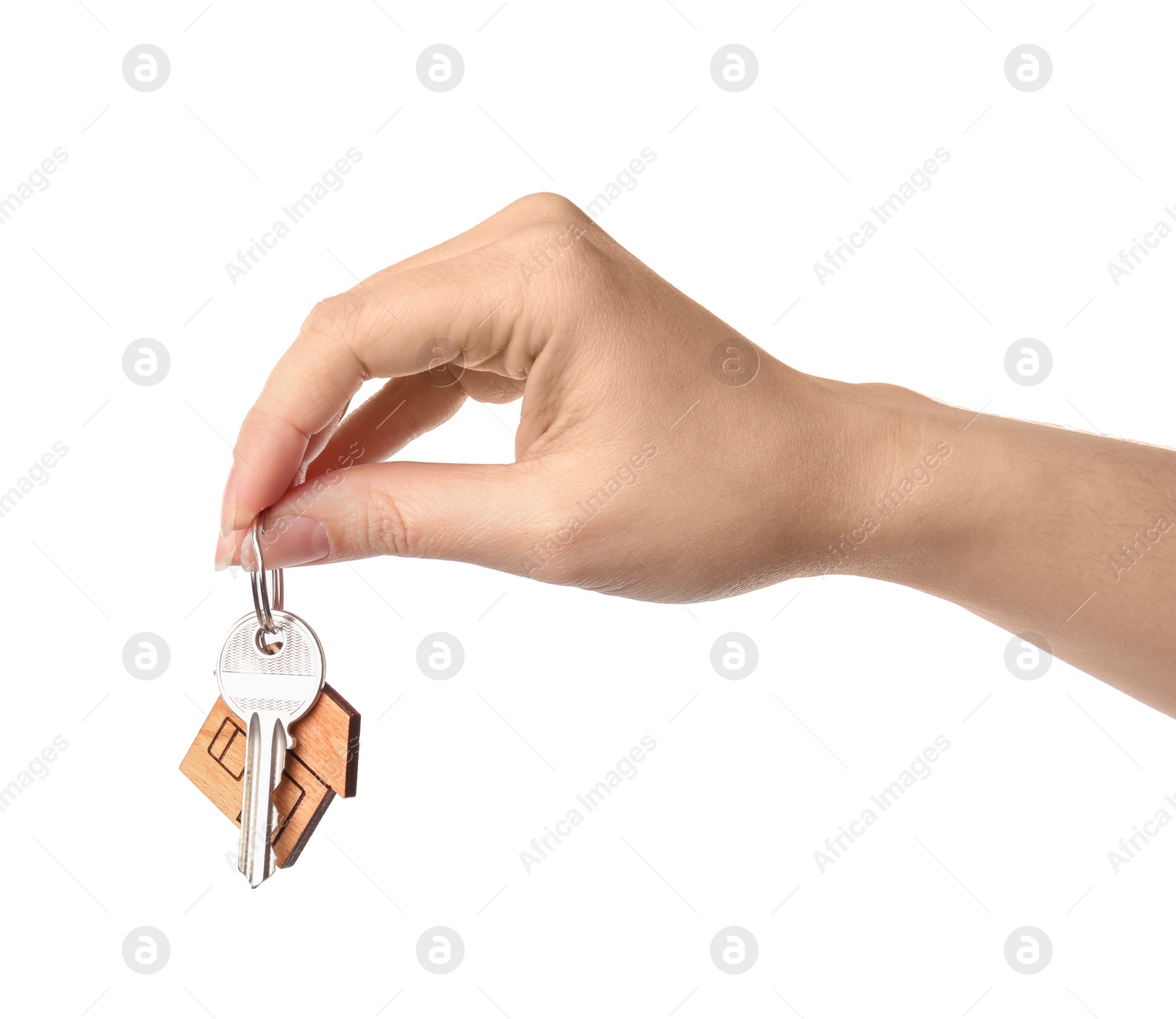 Photo of Woman holding house key with trinket on white background, closeup