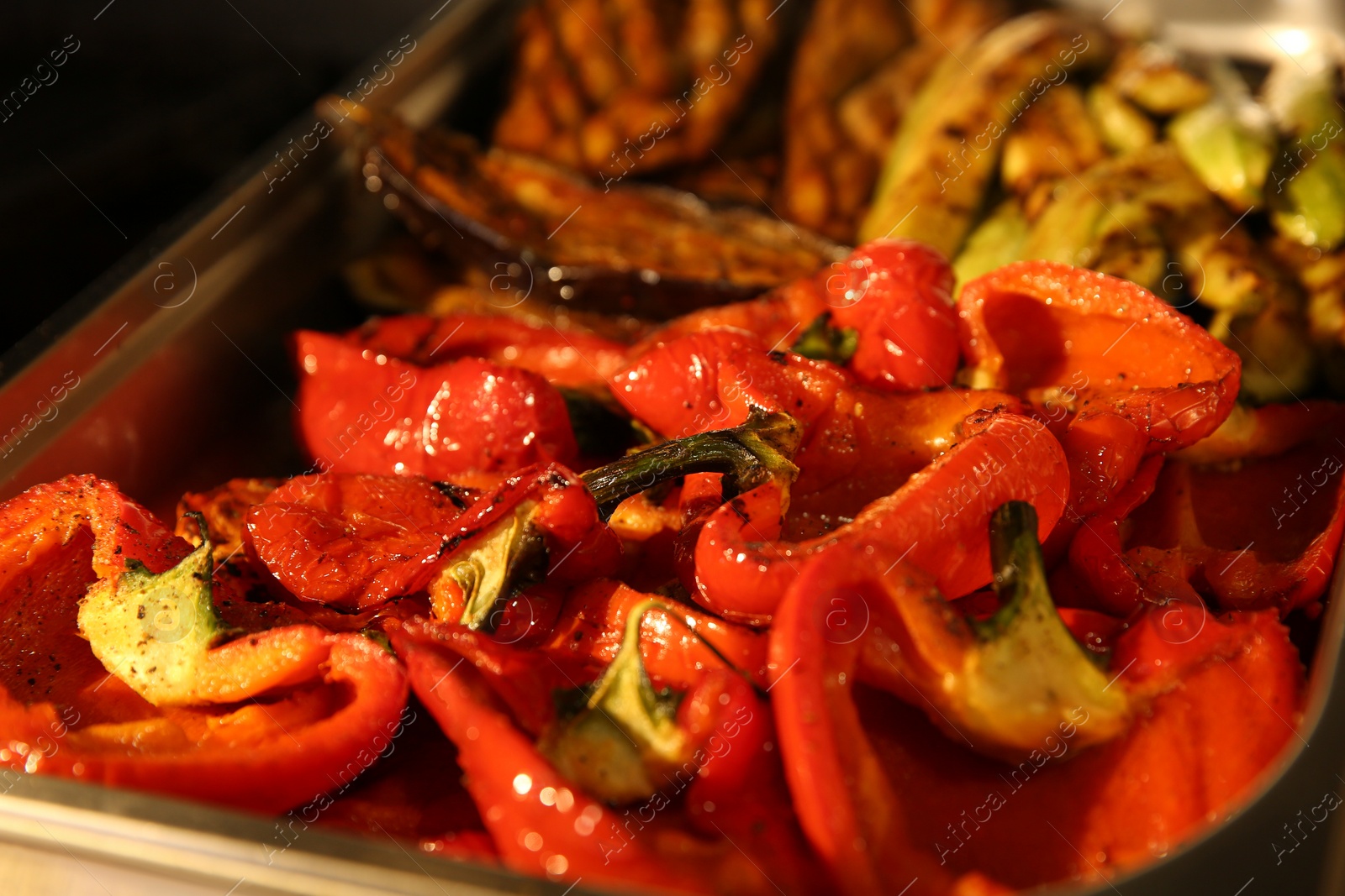 Photo of Pile of delicious grilled vegetables, closeup view