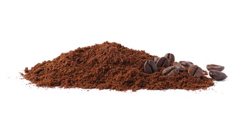 Heap of ground coffee and beans on white background