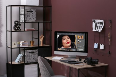 Photo of Retoucher's workplace. Computer with photo editor application, camera, smartphone and graphic tablet on table indoors