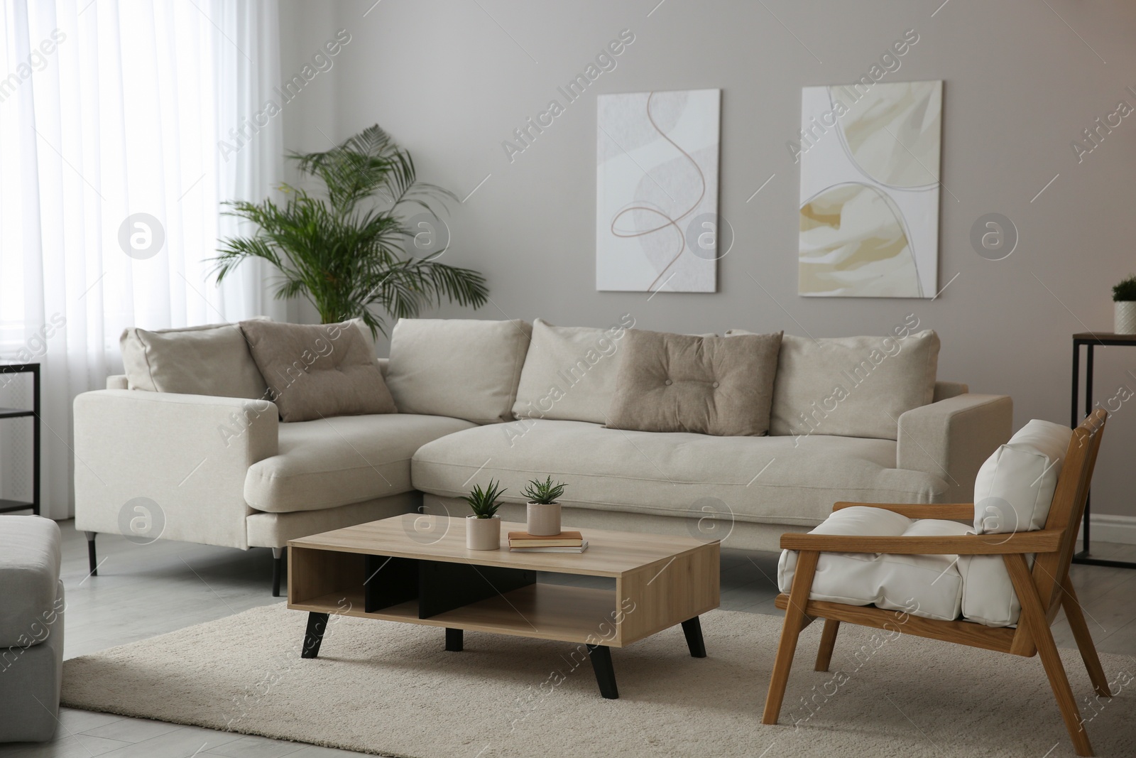 Photo of Big comfortable sofa in living room. Interior design