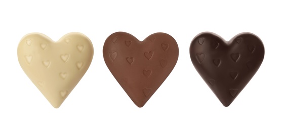 Image of Set with heart shaped chocolate candies on white background