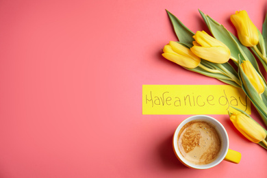 Photo of Aromatic morning coffee, beautiful flowers and card with HAVE A NICE DAY wish on pink background, flat lay. Space for text
