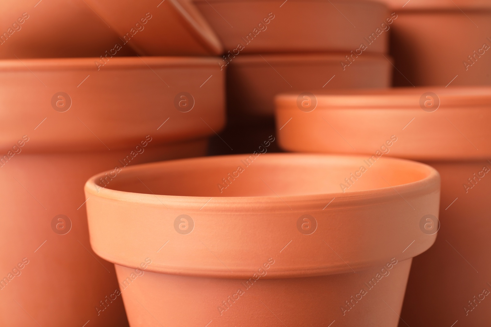 Photo of Many clay flower pots as background, closeup