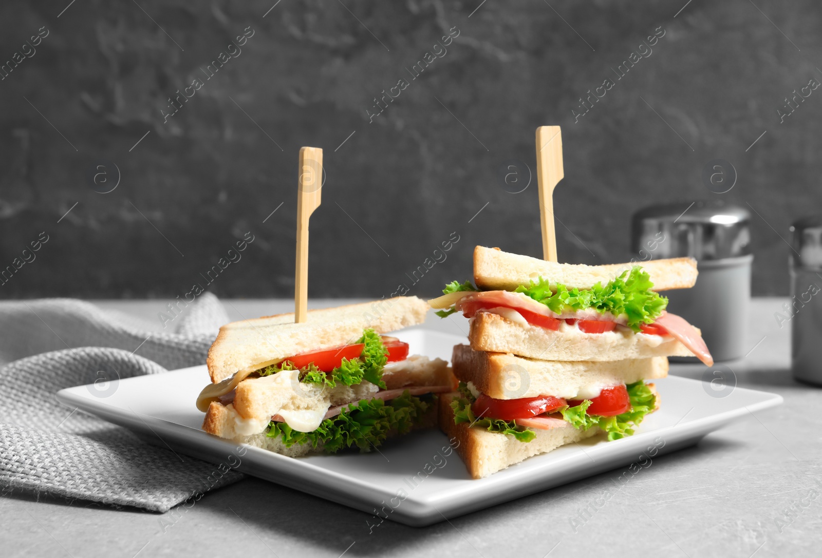 Photo of Tasty toast sandwiches on plate. Wheat bread