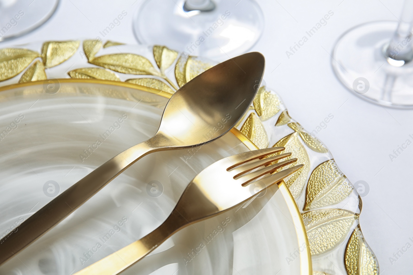 Photo of Elegant table setting on light background, closeup