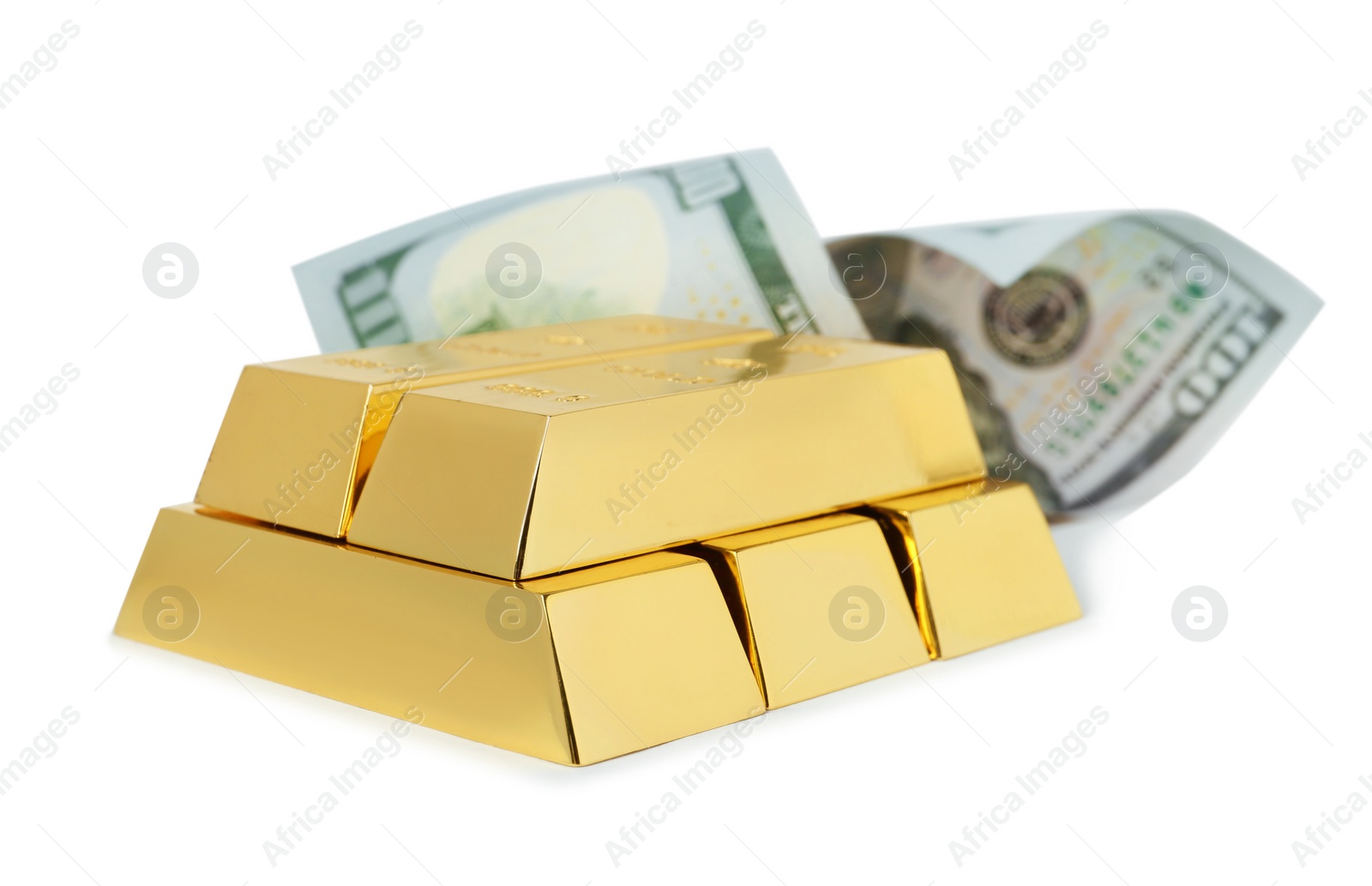 Photo of Shiny gold bars and dollar bill on white background