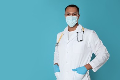 Doctor or medical assistant (male nurse) with protective mask and stethoscope on turquoise background. Space for text