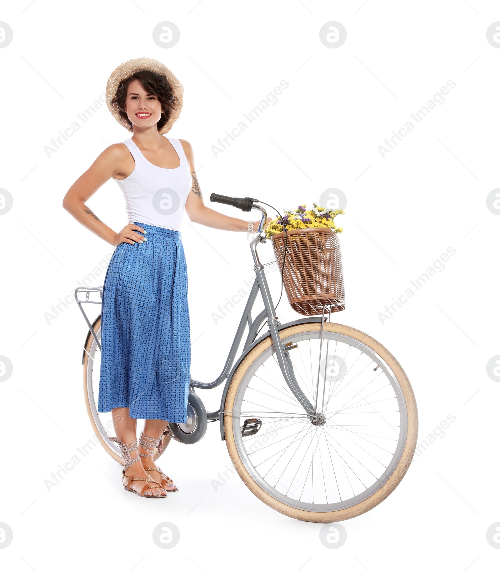 Photo of Portrait of beautiful young woman with bicycle on white background