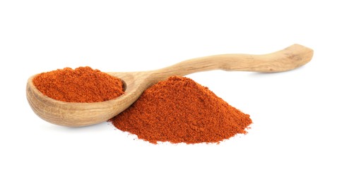 Photo of Wooden spoon and aromatic paprika powder isolated on white
