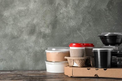 Photo of Various takeout containers on table, space for text. Food delivery service