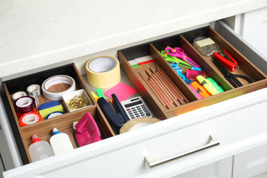 Photo of Different stationery in open desk drawer indoors