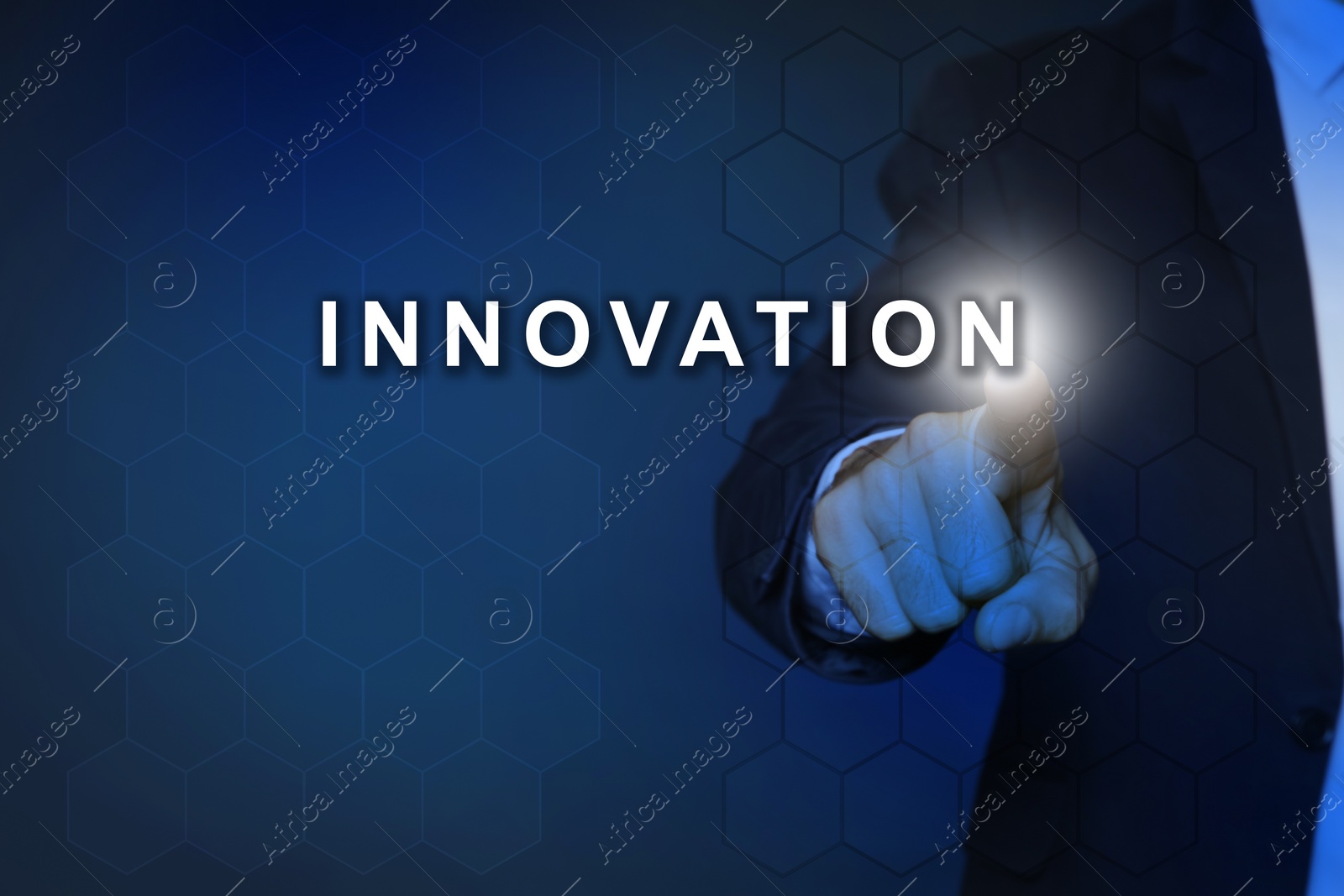 Image of Man touching word Innovation on digital screen against dark blue background, closeup