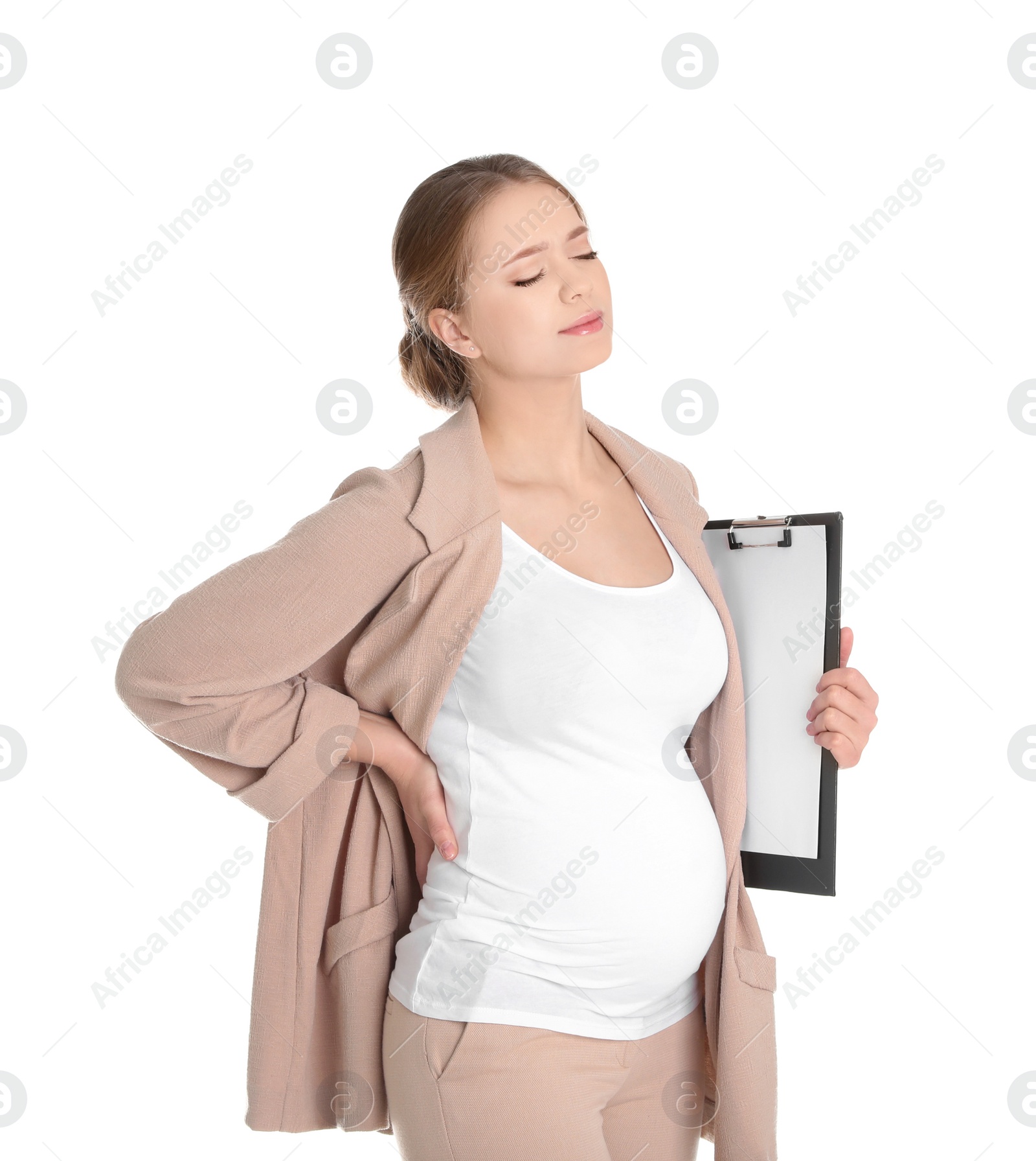 Photo of Young pregnant woman suffering from pain on white background. Working while expecting baby