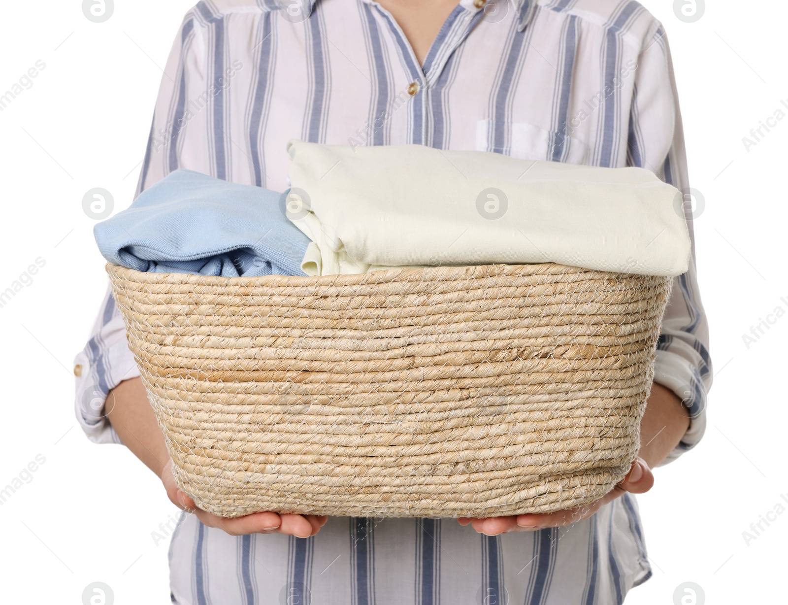 Photo of Woman with basket full of clean laundry on white background, closeup