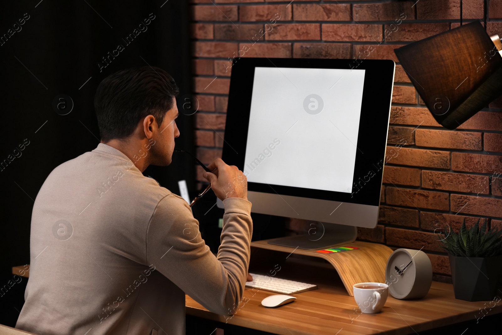 Photo of Journalist working with modern computer in office