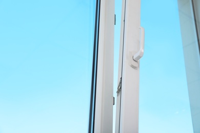 View of blue sky through modern window indoors