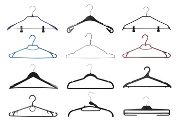 Image of Set with different empty hangers on white background