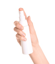 Young woman holding bottle with hand cream on white background