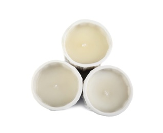 Candles in holders on white background, top view. Christmas decoration