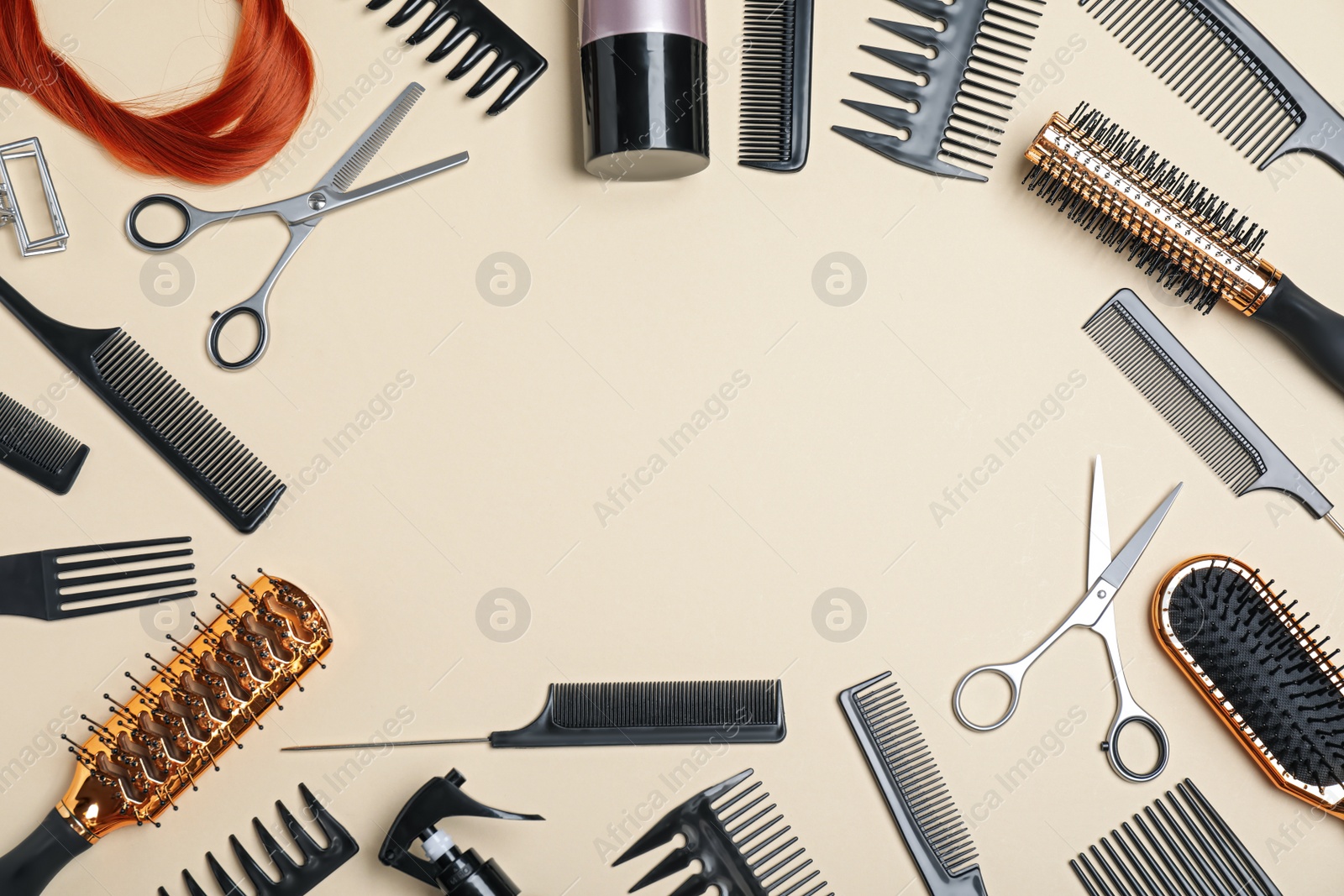 Photo of Flat lay composition of professional scissors, hair strand and other hairdresser's equipment on beige background, space for text. Haircut tool
