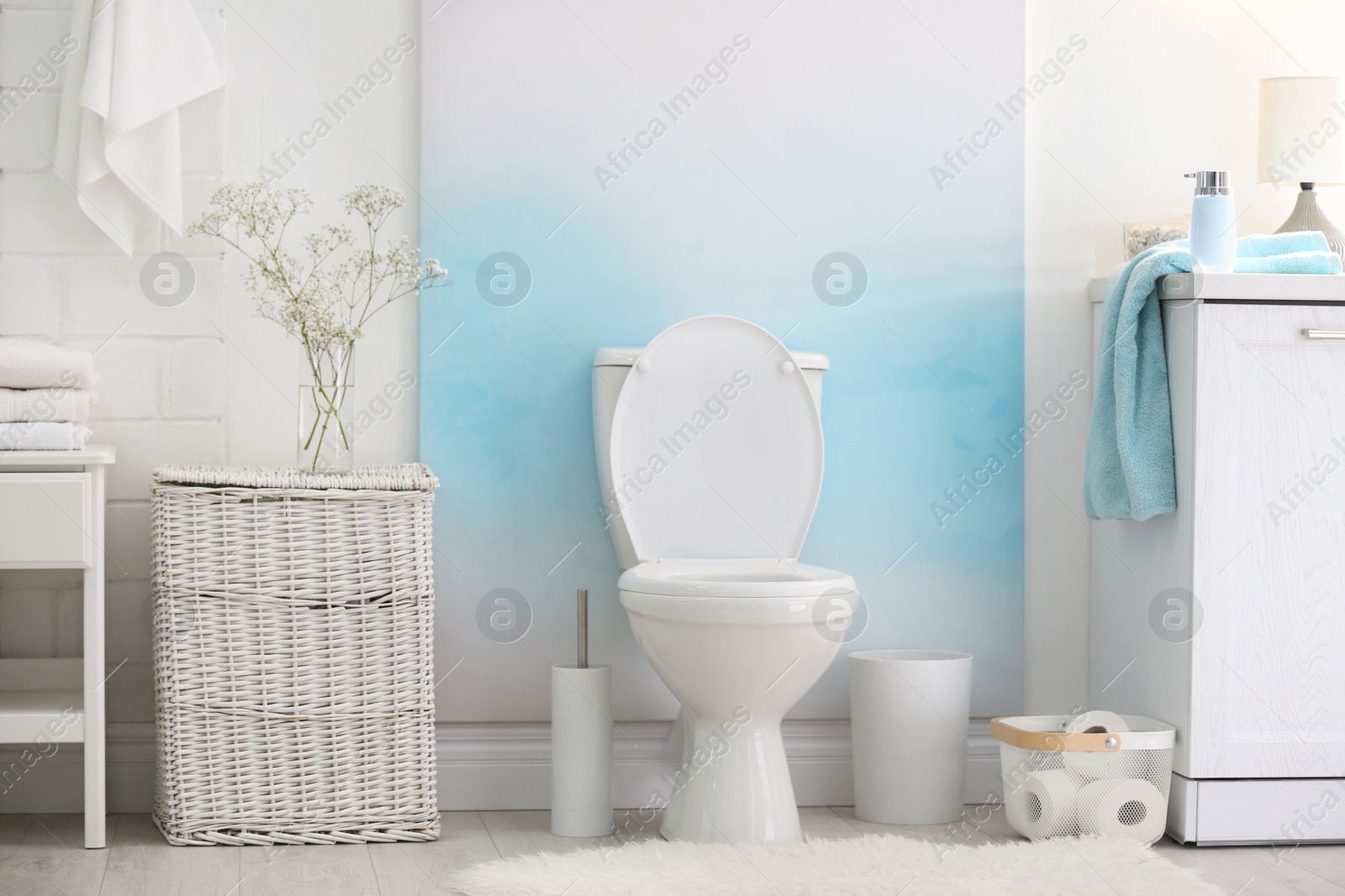 Photo of Modern toilet bowl in stylish bathroom interior